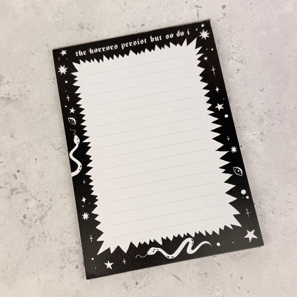 Black and white decorative card with text on a gray surface